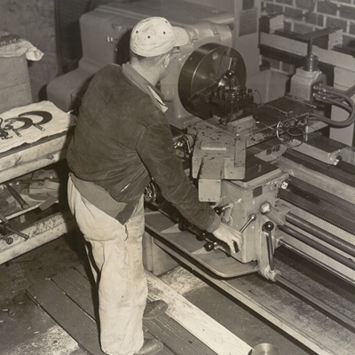 Worker at Press of Historic Bonnell Aluminum